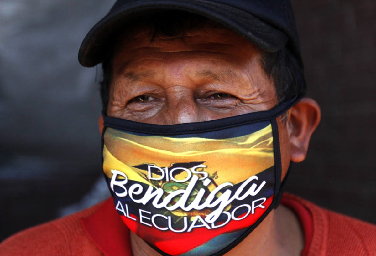 The mask reads “God Bless Ecuador”