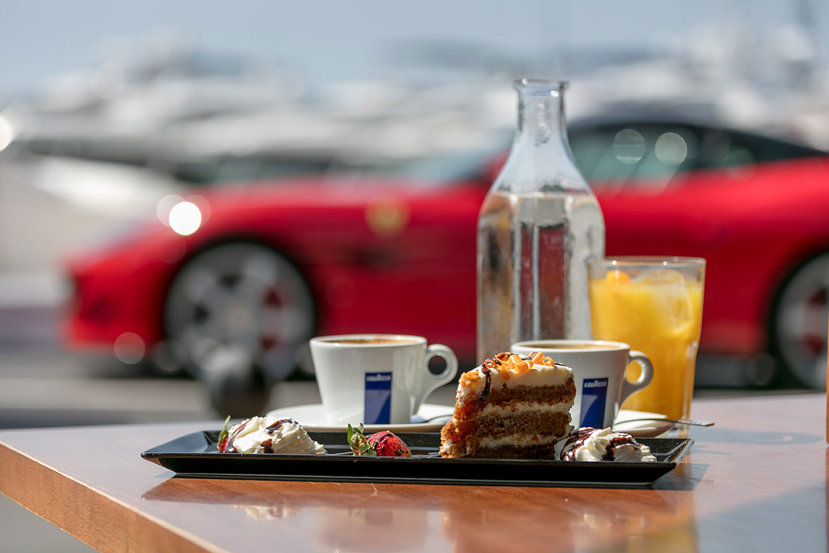 Grab a coffee, sit back and enjoy the people/car show!