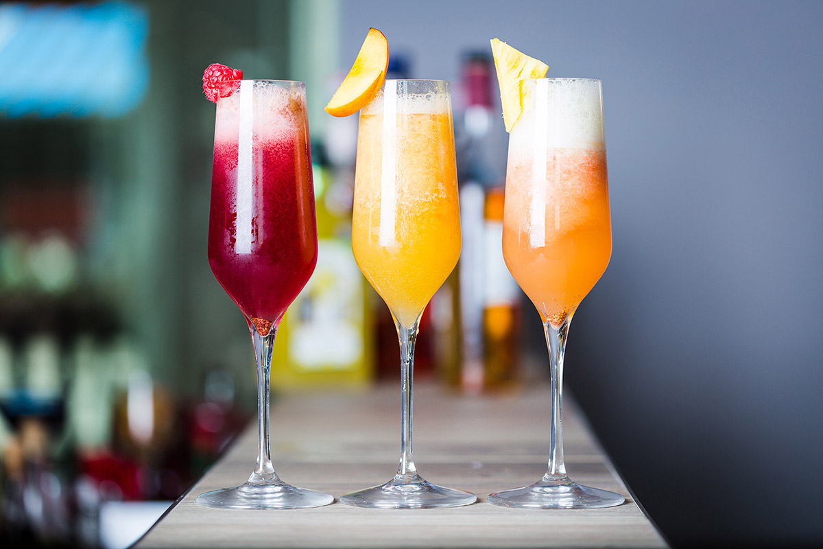 Three colourful champagne Cocktails